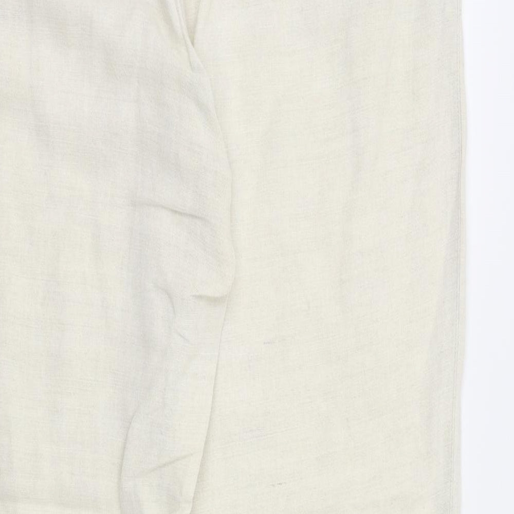Brand and care label for Etam women’s ivory trousers, size UK 16, 31-inch leg