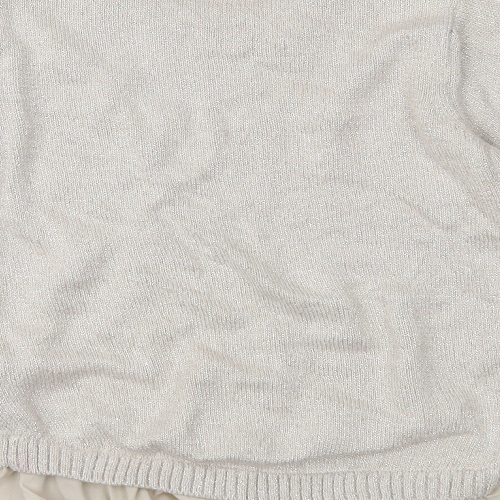 Brand and care label for Marks & Spencer girls’ beige knit jumper, size 9-10, years