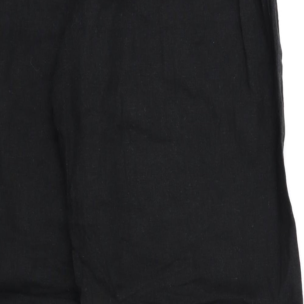 Brand and care label for Anucci women’s black trousers, size UK 16, 29-inch leg