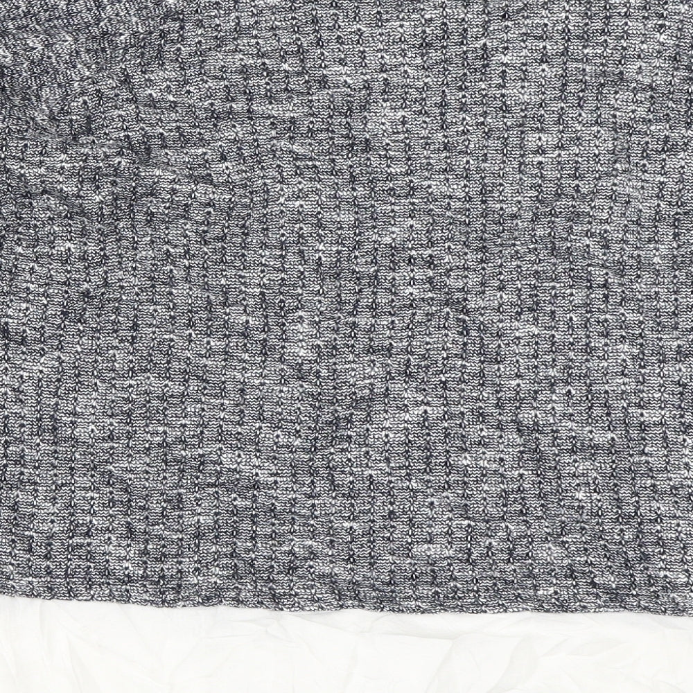 Brand and care label for Marks & Spencer women’s blue jumper, size UK 16
