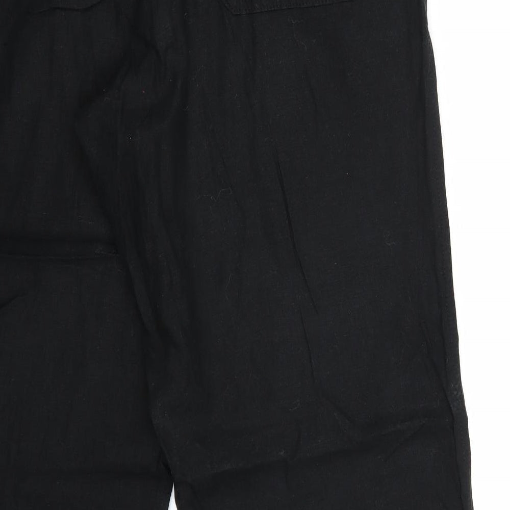 Brand and care label for Marks & Spencer women’s black trousers, size UK 34, 28-inch leg