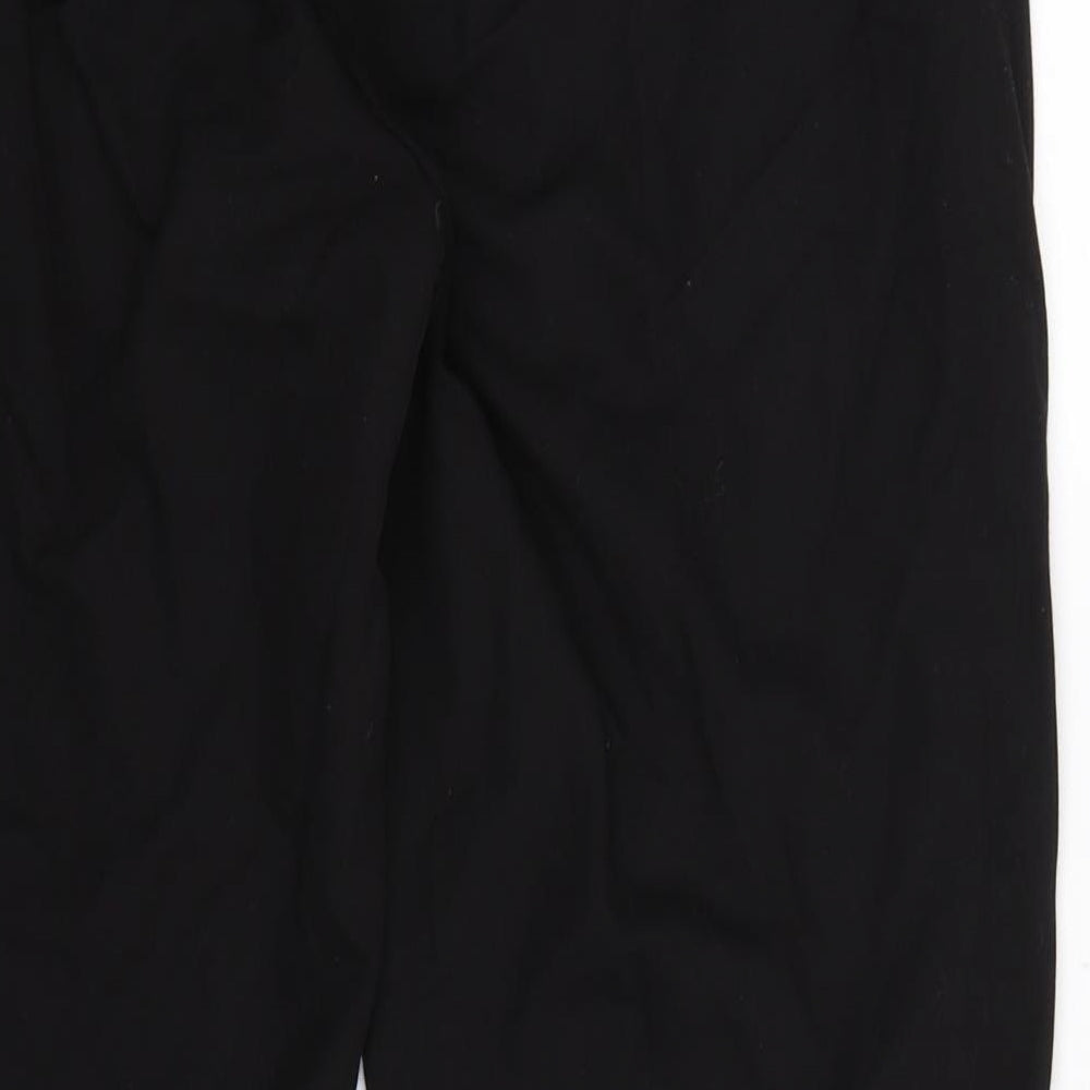 Brand and care label for Nutmeg women’s black striped dress pants trousers, size UK 12, 27-inch leg
