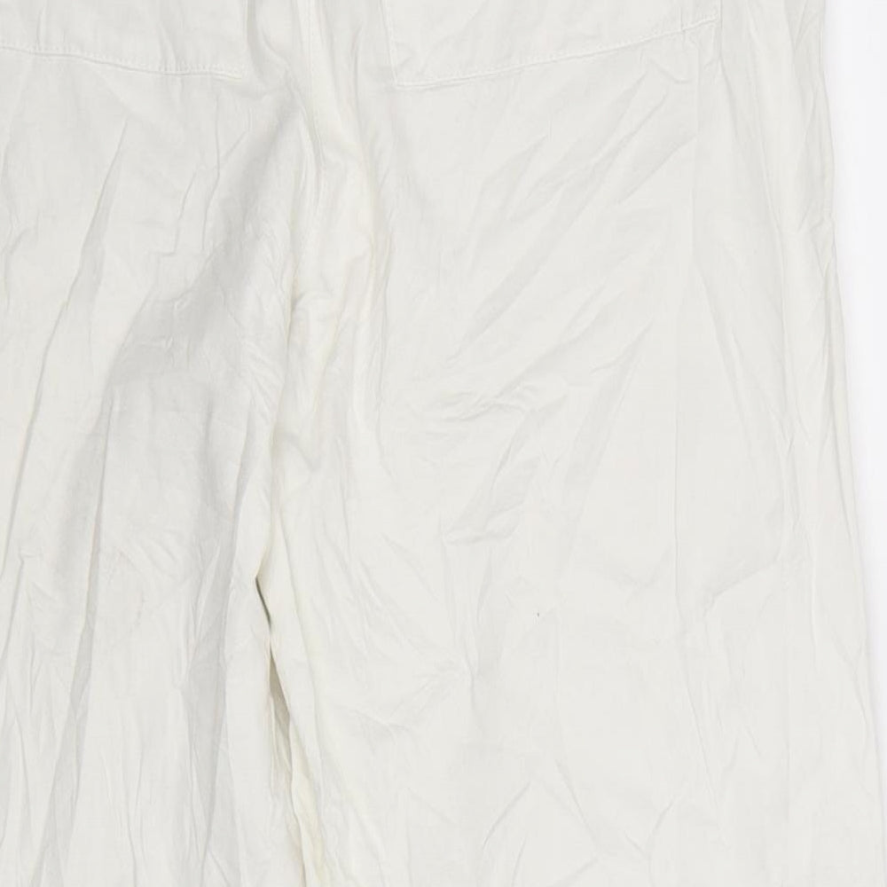 Brand and care label for MAC women’s white trousers, size UK 30, in, 25-inch leg