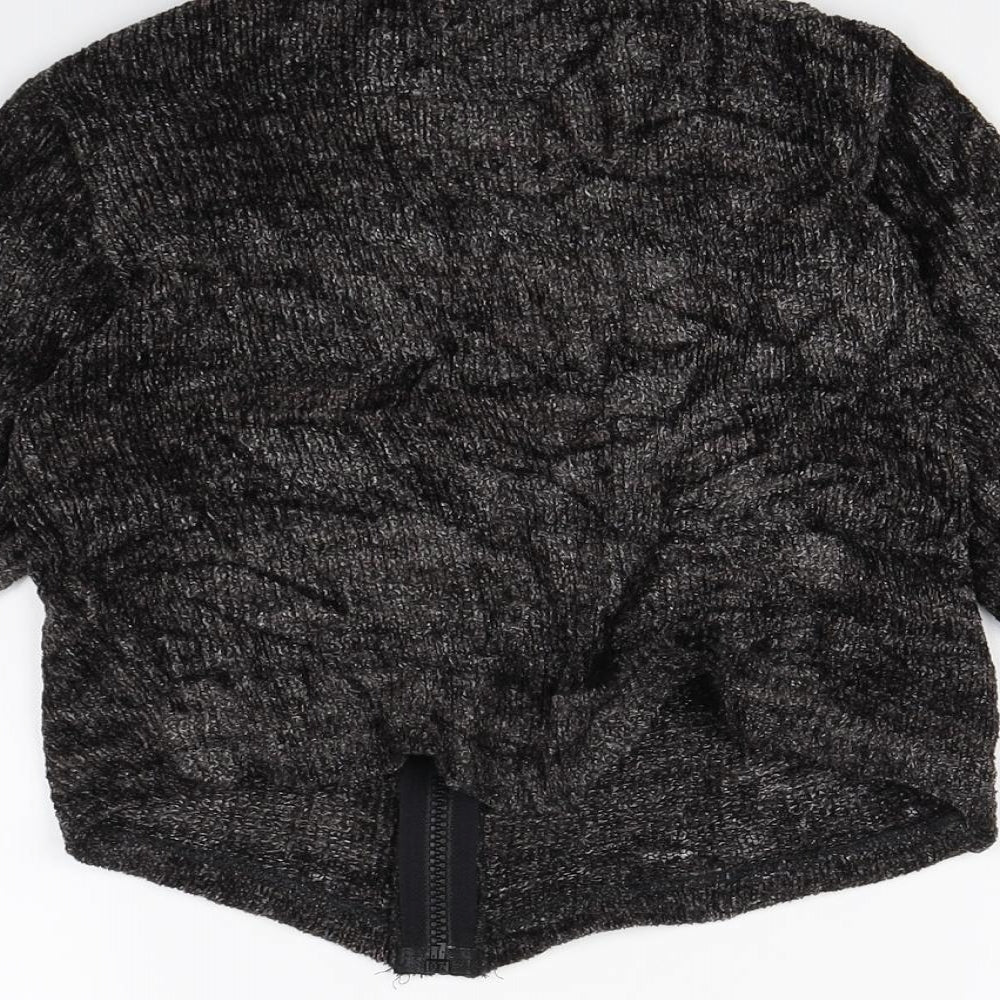 Brand and care label for NOKAIO girls’ black cardigan jumper, size 4, years