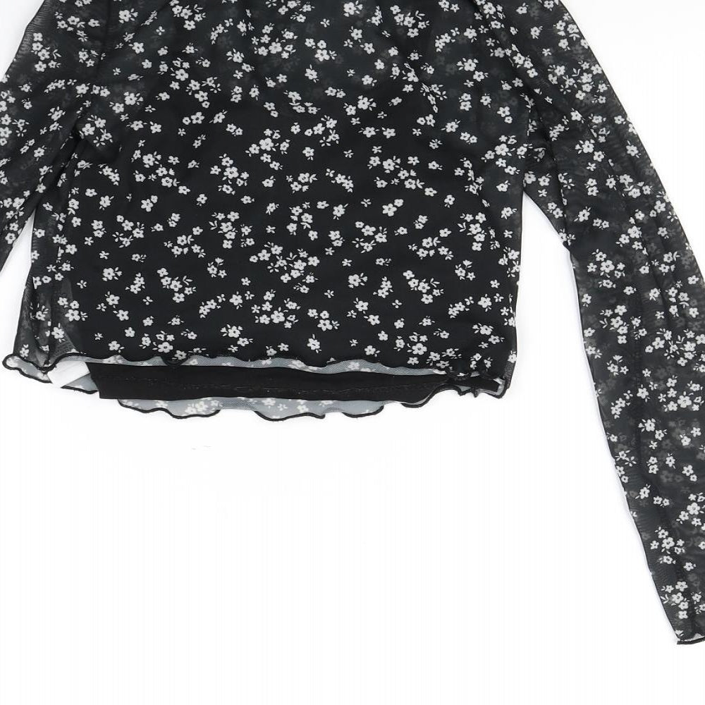 Brand and care label for New Look girls’ black polka dot basic blouse, size 10, years