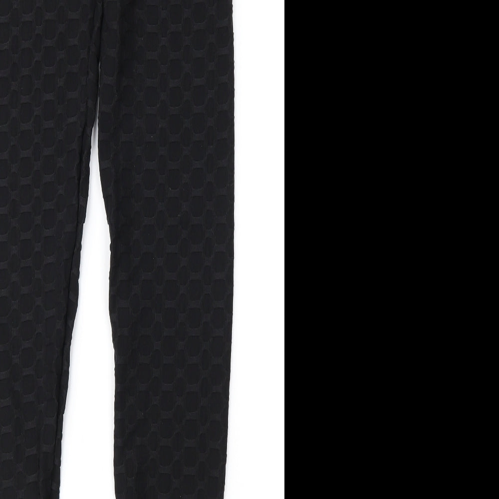 Brand and care label for Preworn women’s black geometric carrot leggings, size S, 28-inch leg