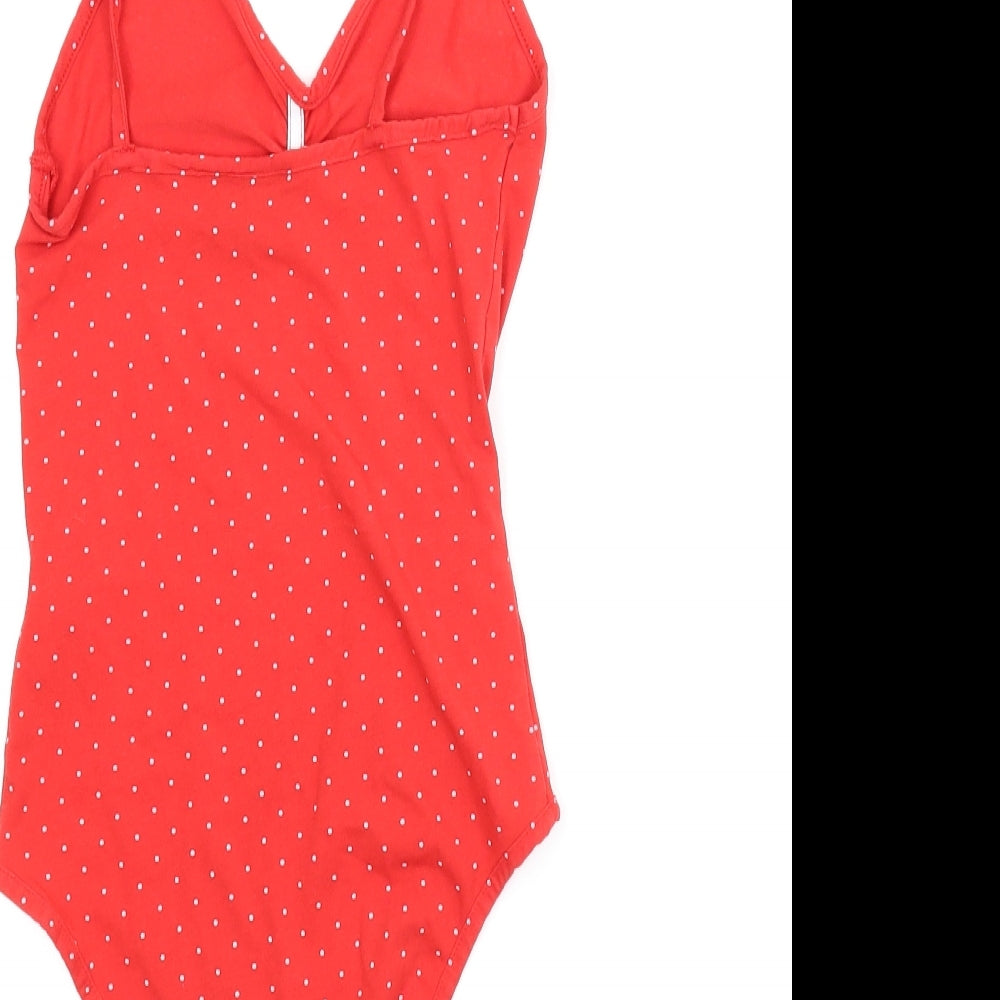 Brand and care label for Topshop women’s red polka dot romper one-piece, size UK 6