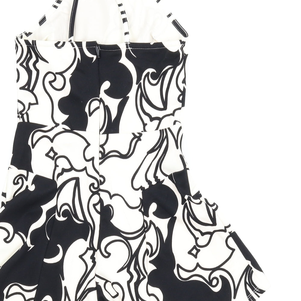Brand and care label for Topshop women’s white floral romper one-piece, size UK 8