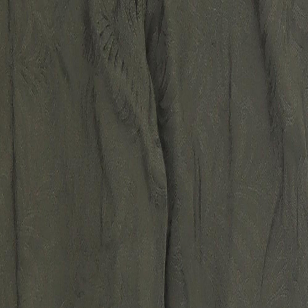 Brand and care label for H&M women’s green trousers, size UK 8, 24-inch leg - leaf print
