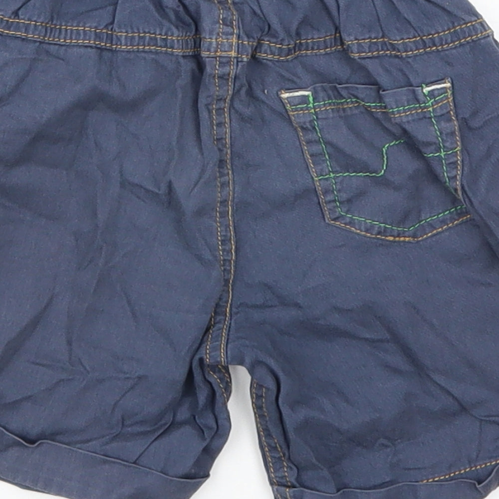 Brand and care label for Next boys’ blue cropped trousers, size 12-18, months