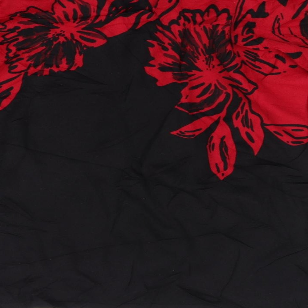 Brand and care label for EWM women’s red floral jumper, size M