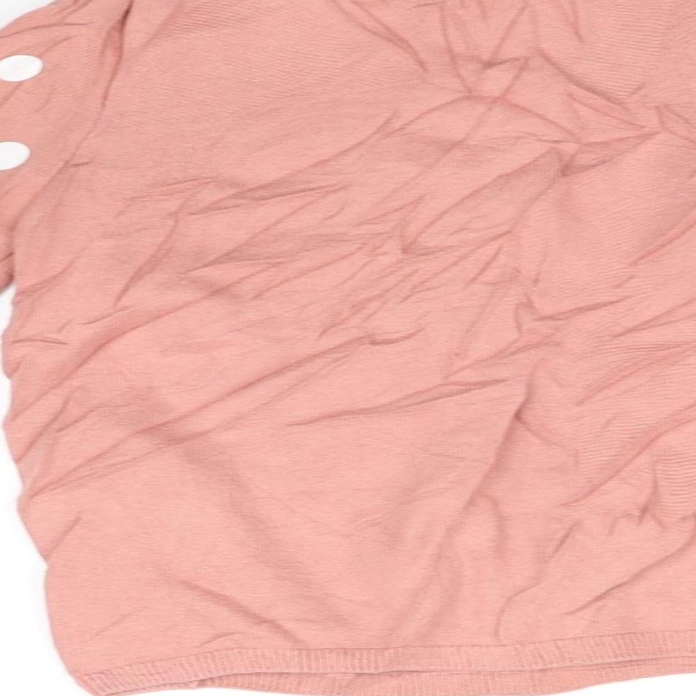 Brand and care label for H&M girls’ pink jumper, size 6-7, years - poka dot