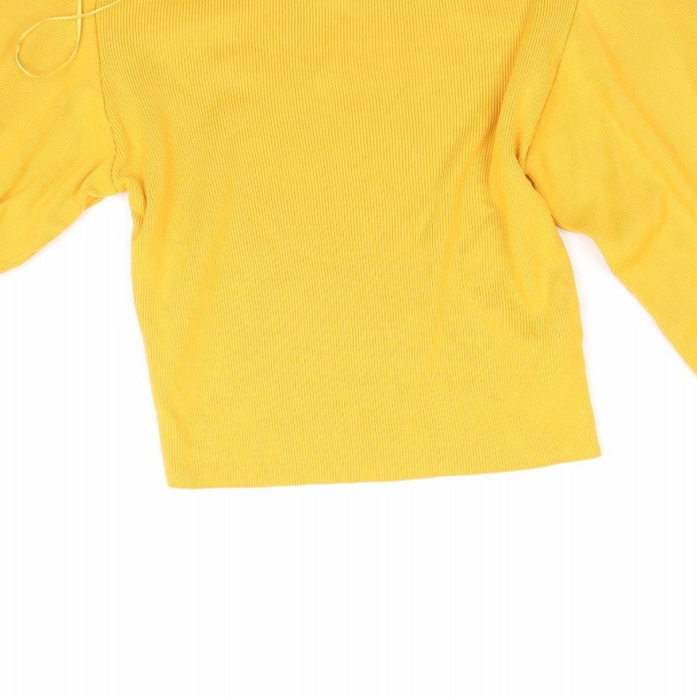 Brand and care label for Topshop women’s orange corduroy jumper, size UK 8