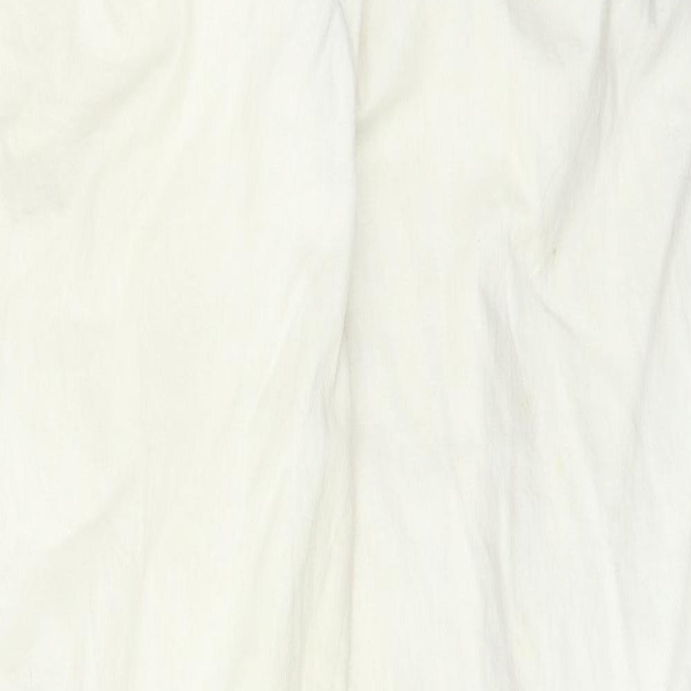 Brand and care label for Vintage Casuals women’s beige trousers, size UK 14, 31-inch leg