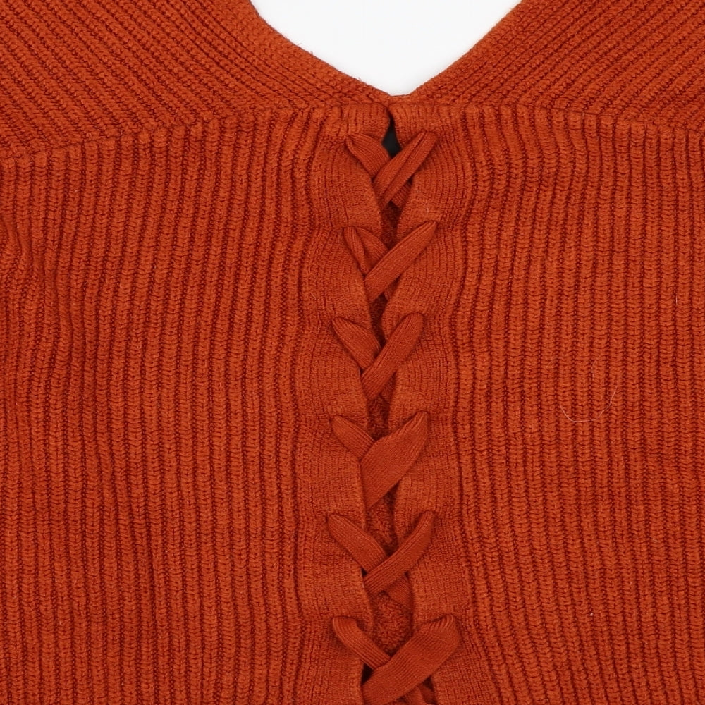 Brand and care label for New Look women’s orange jumper, size M