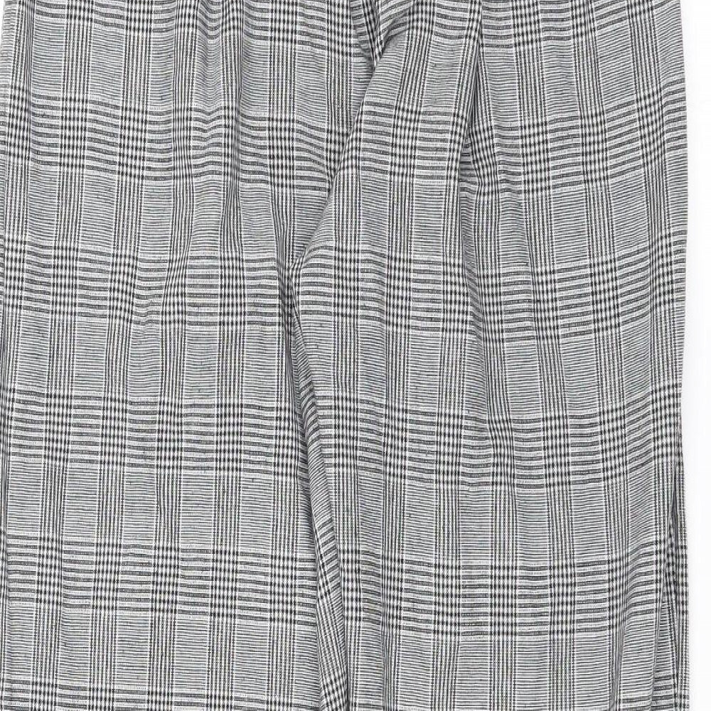Brand and care label for Preworn women’s black check trousers, size L, 26-inch leg
