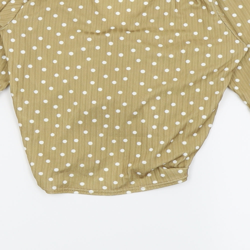 Brand and care label for New Look women’s beige polka dot cropped t-shirt, size UK 8