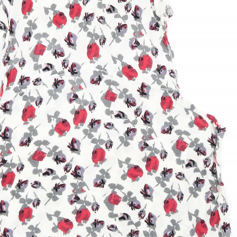 Brand and care label for Karen Cole women’s white floral jumper, size S