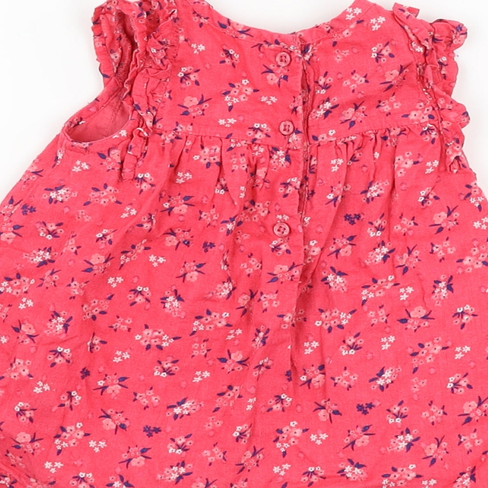 Brand and care label for George girls’ pink floral basic tank, size 3-6, months