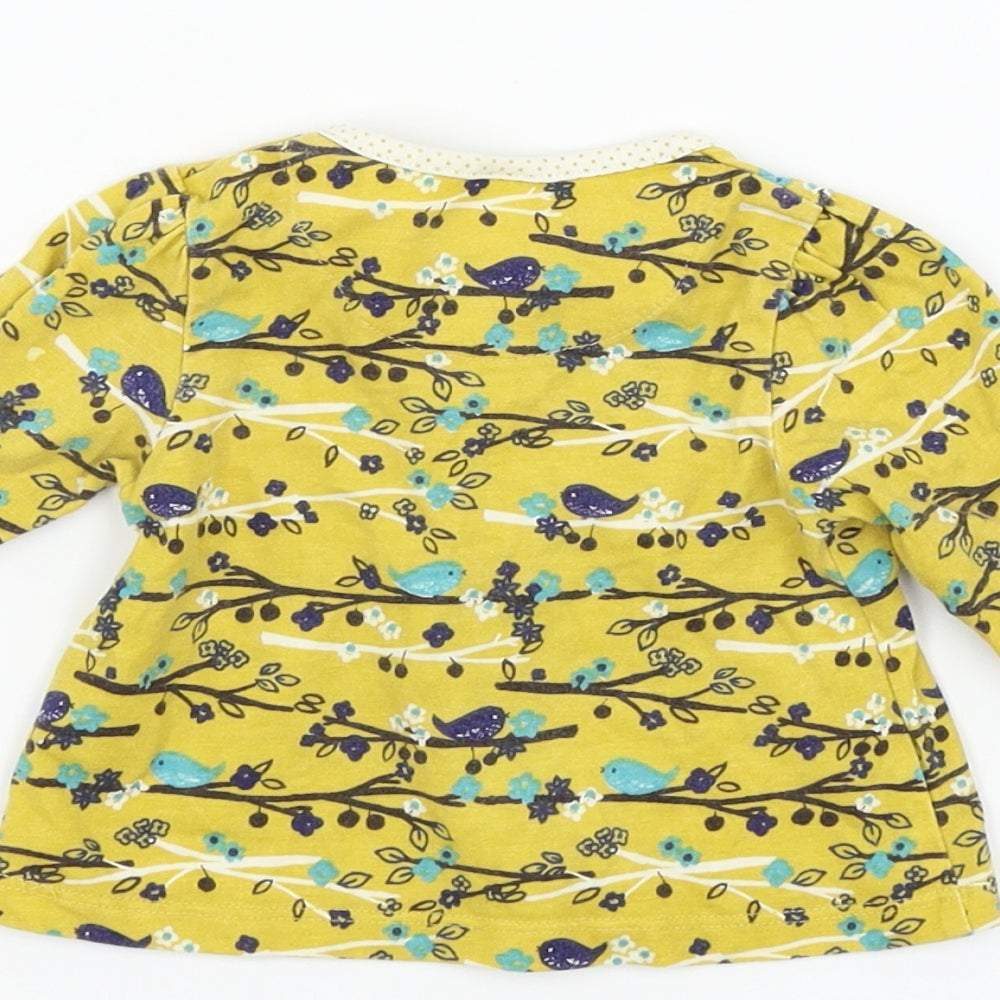 Brand and care label for Boots Mini Club girls’ yellow floral basic t-shirt, size 0-3, months