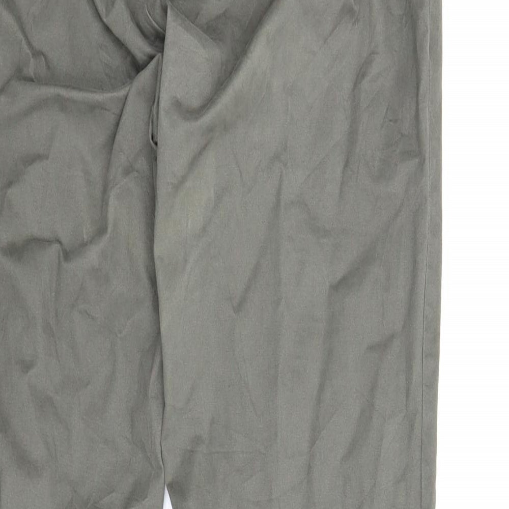 Brand and care label for Up Fashion women’s green carpenter trousers, size UK 16, 29-inch leg