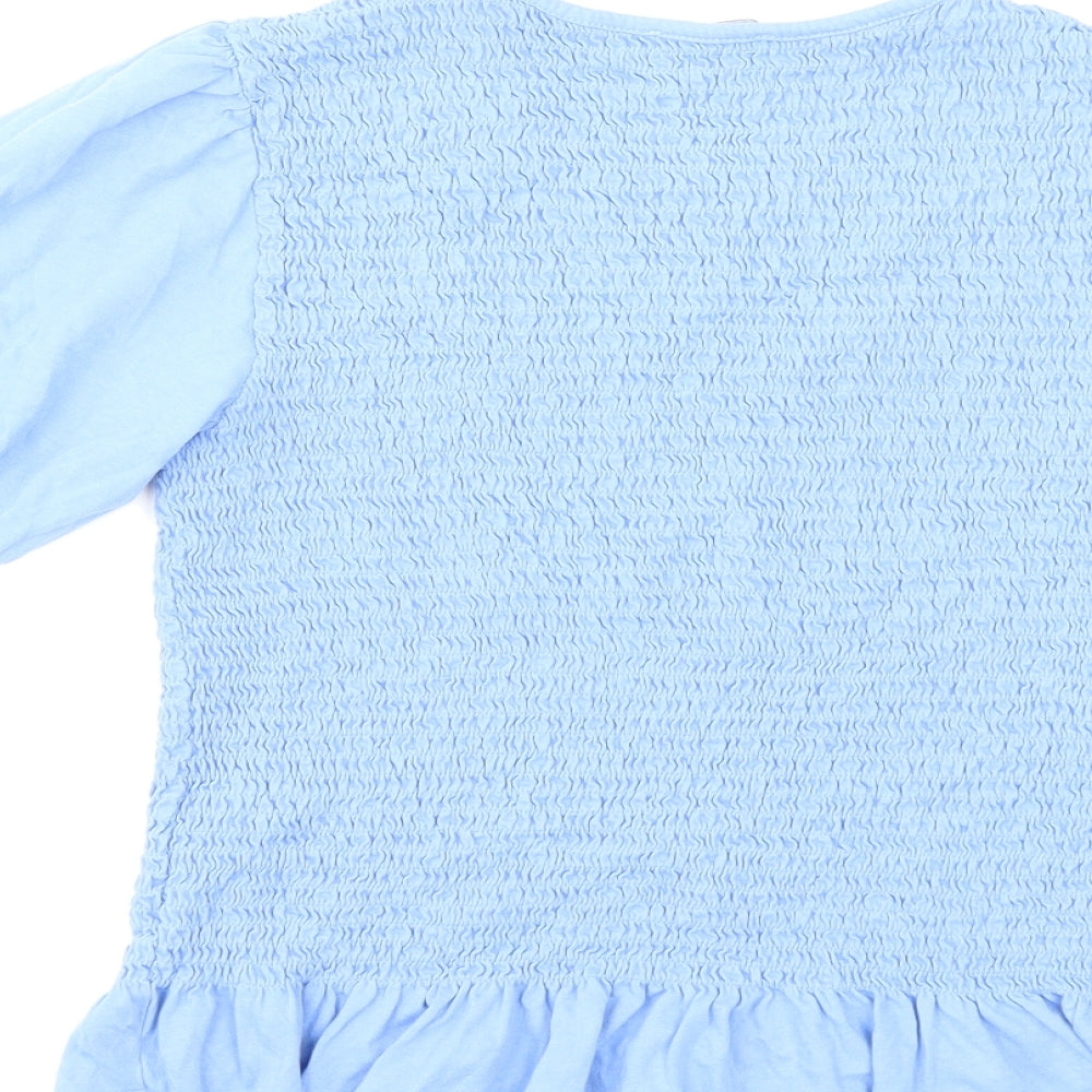 Brand and care label for New Look women’s blue basic t-shirt, size UK 16