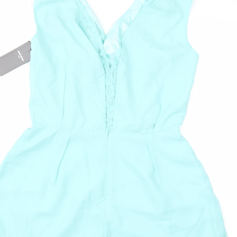 Brand and care label for Amber Krystal women’s blue playsuit one-piece, size M