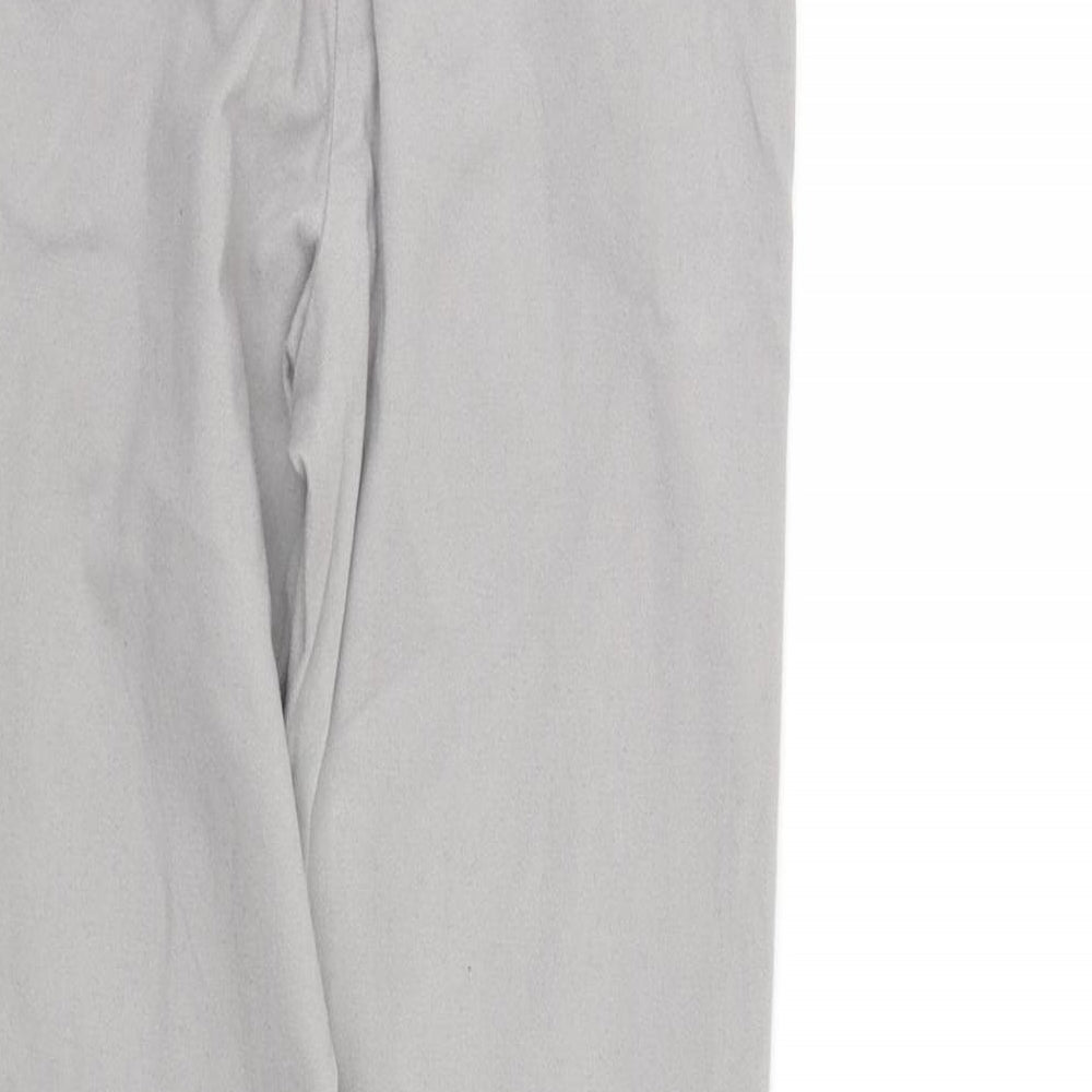 Brand and care label for Next girls’ green chino trousers, size 8, years