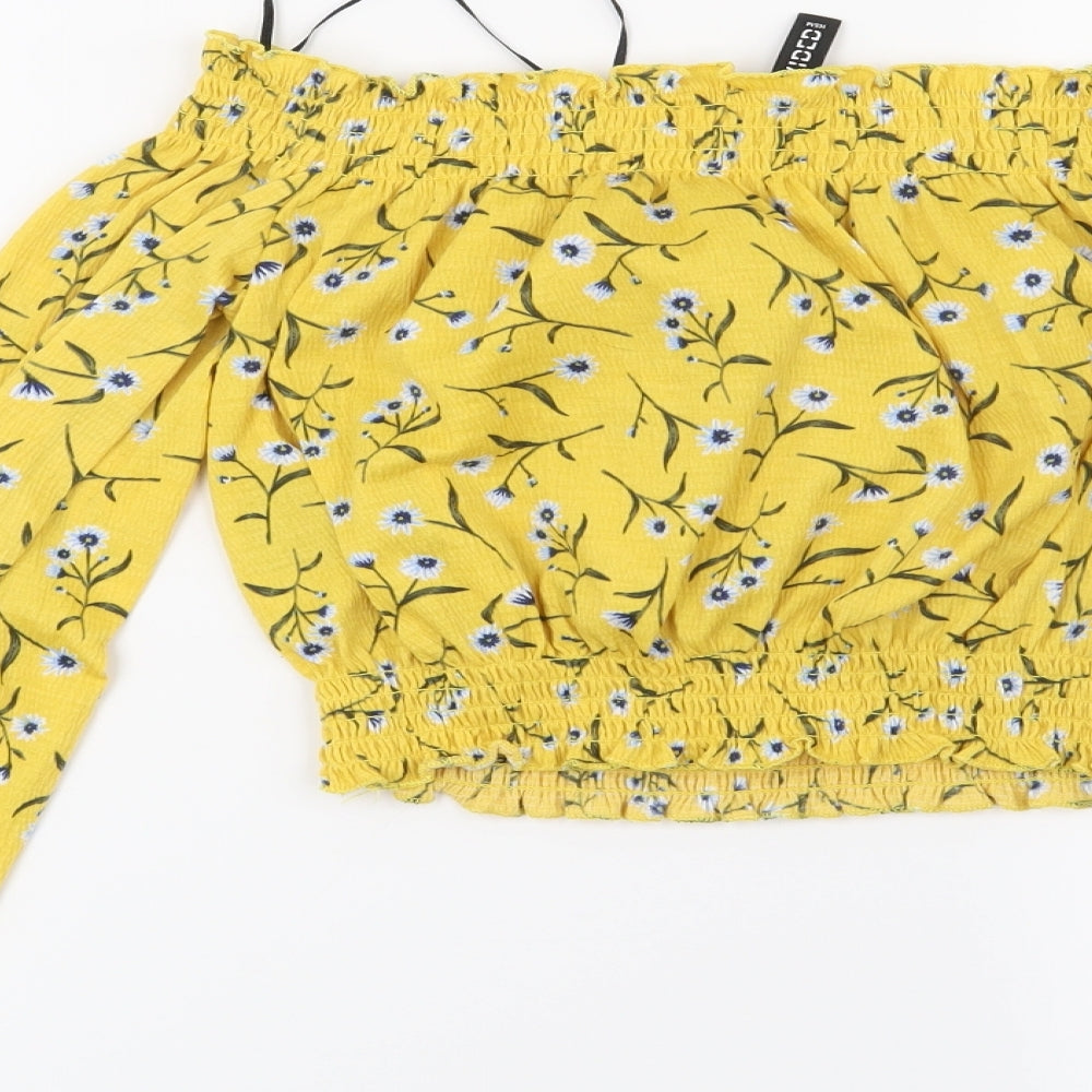Brand and care label for H&M women’s yellow floral basic blouse, size XS