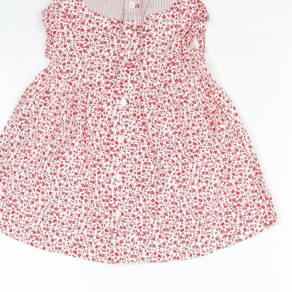 Brand and care label for Preworn girls’ red floral fit & flare, size 9-12, months