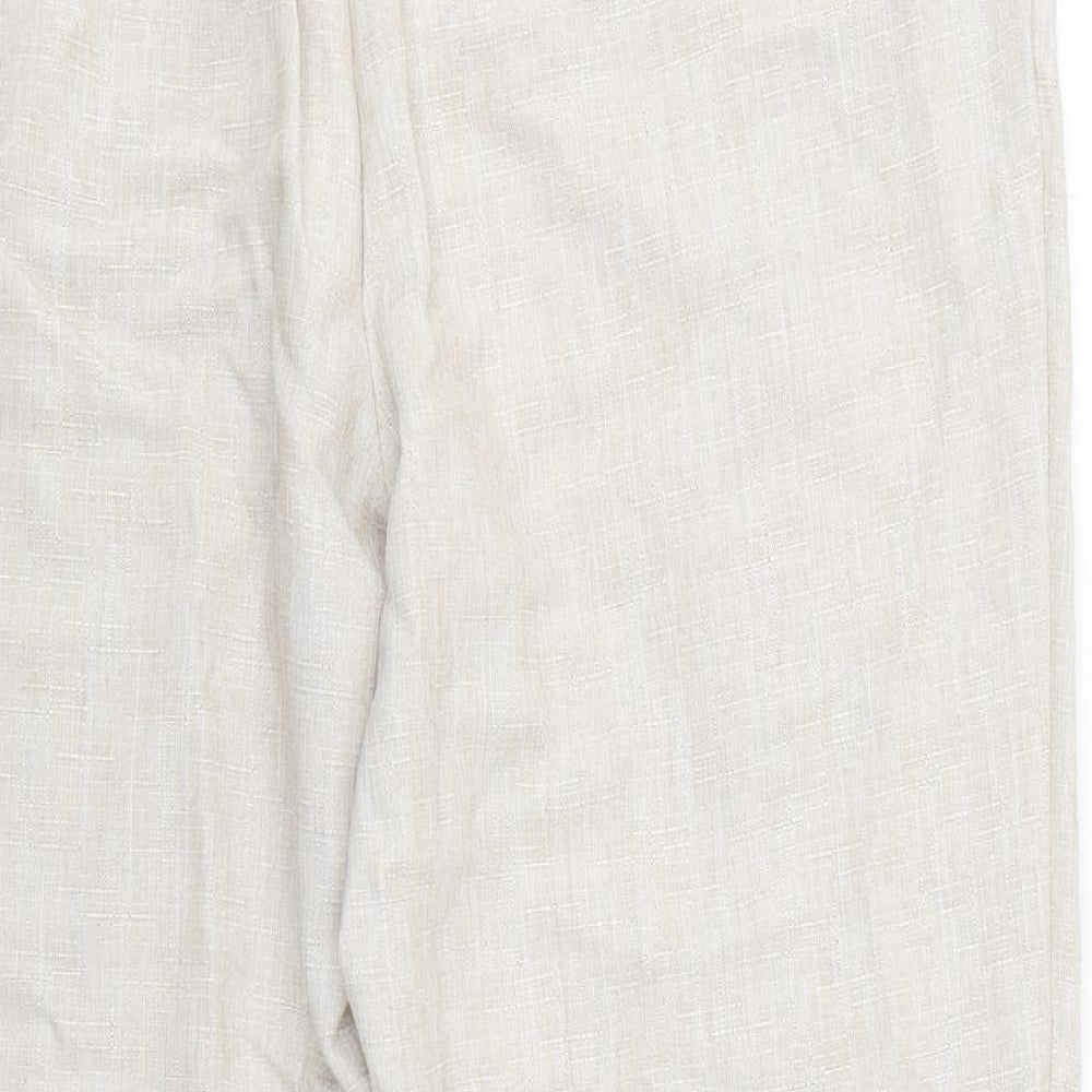 Brand and care label for Marks & Spencer women’s beige rayon trousers, size UK 16, 28-inch leg