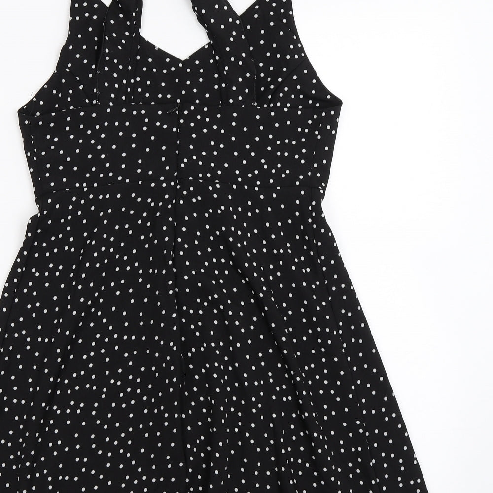 Brand and care label for Preworn women’s black polka dot chiffon camisole blouse, size M