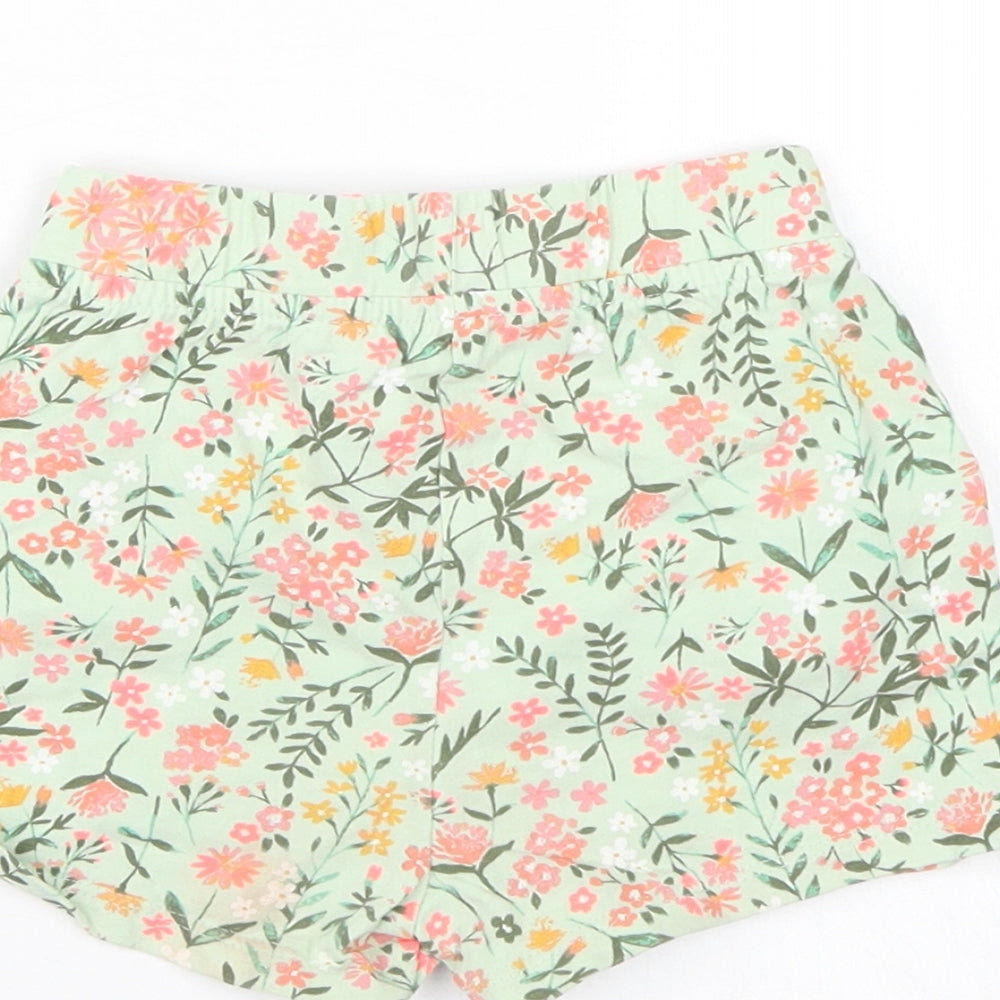 Brand and care label for George girls’ green floral bermuda shorts, size 2, years
