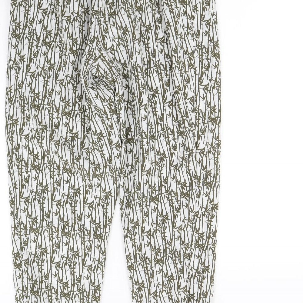 Brand and care label for Topshop women’s green floral trousers, size UK 10, 28-inch leg