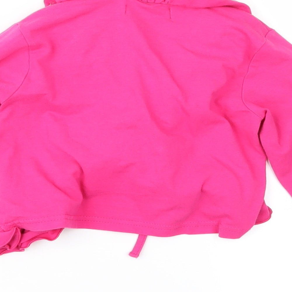 Brand and care label for Pom Pom girls’ pink jersey jacket, size 6, years