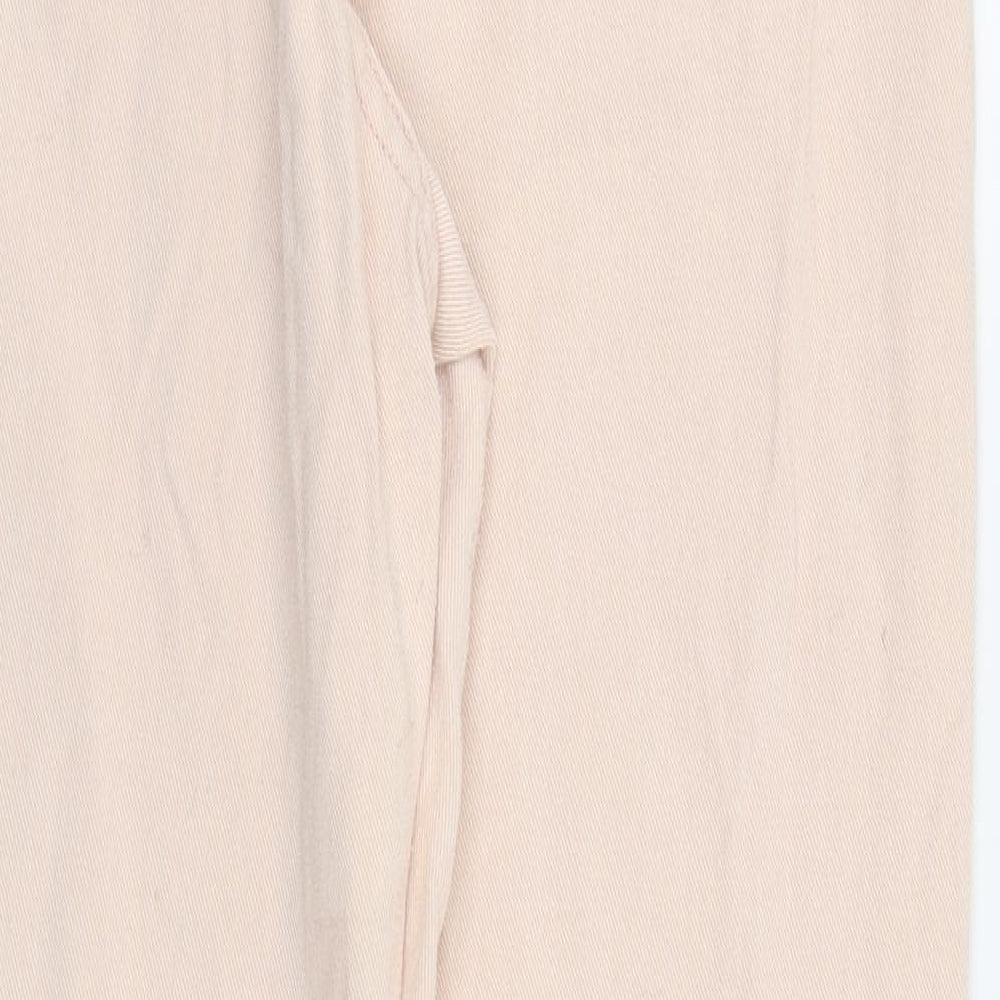 Brand and care label for Boohoo women’s pink skinny jeans, size UK 12, 25-inch leg