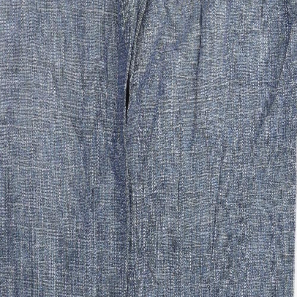Brand and care label for RESERVED women’s blue trousers, size UK 31, in, 32-inch leg