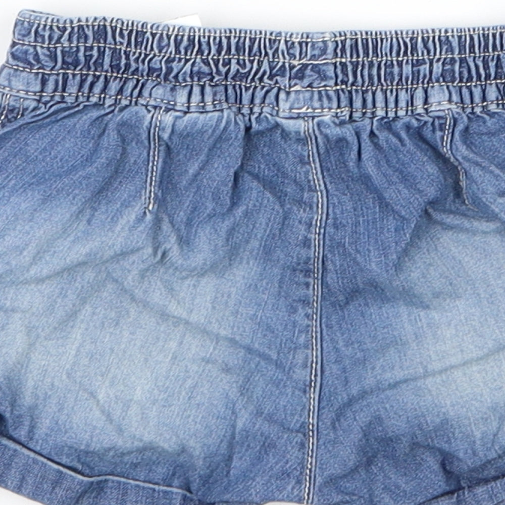 Brand and care label for H&M girls’ blue cropped jeans, size 12, months