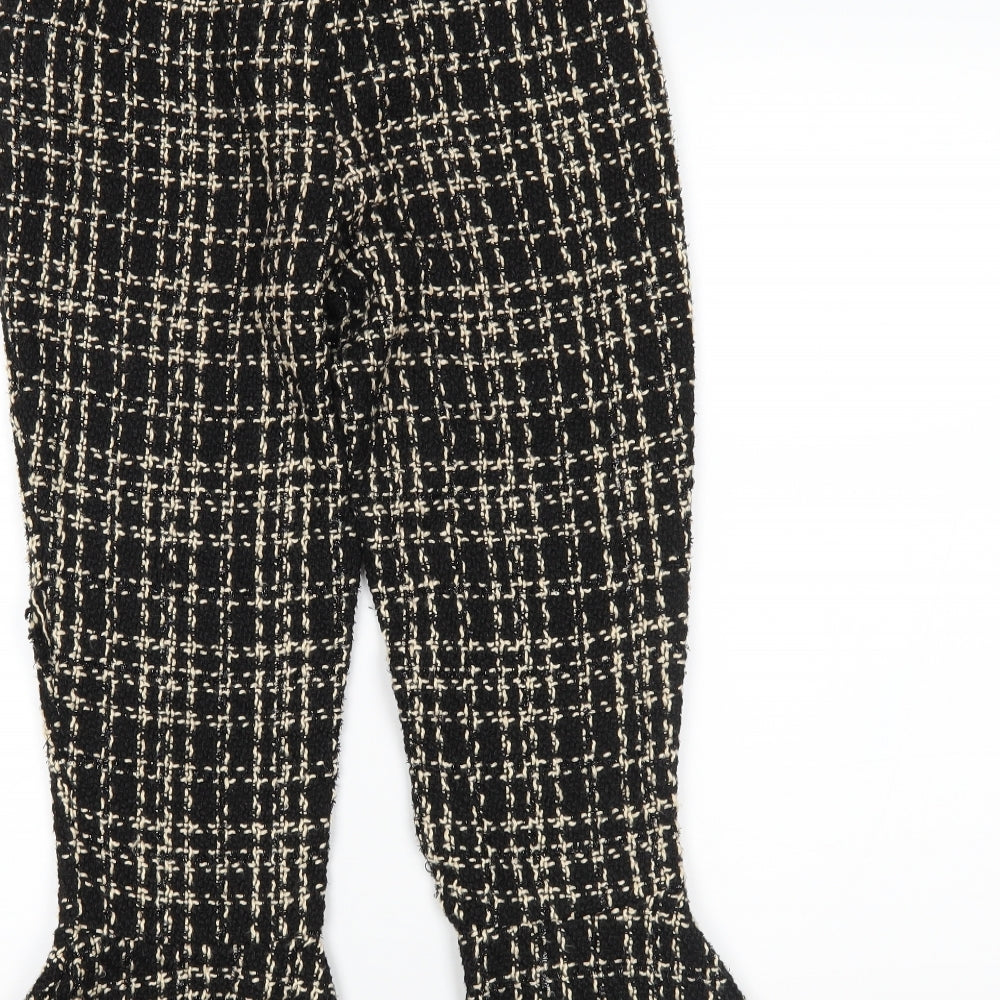Brand and care label for Missguided women’s black plaid trousers, size UK 8, 22-inch leg