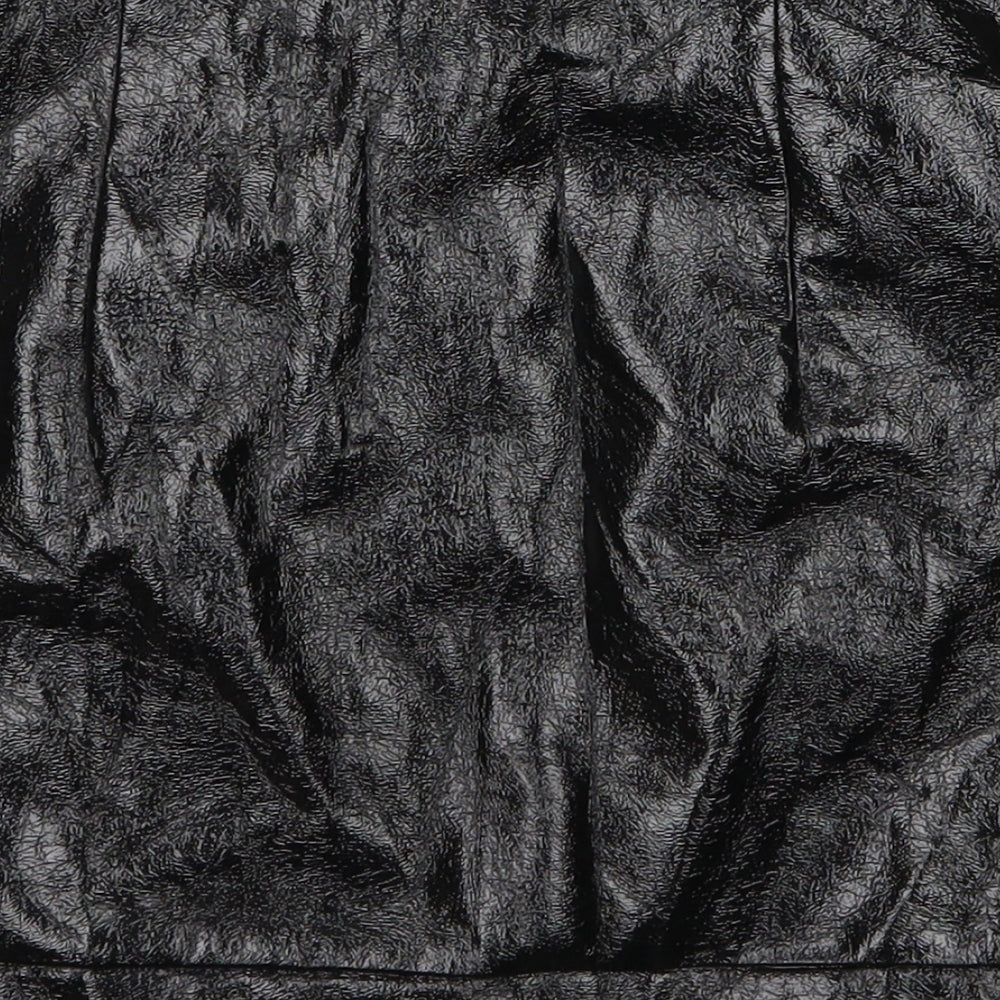Brand and care label for Topshop women’s black mini skirt, size UK 8