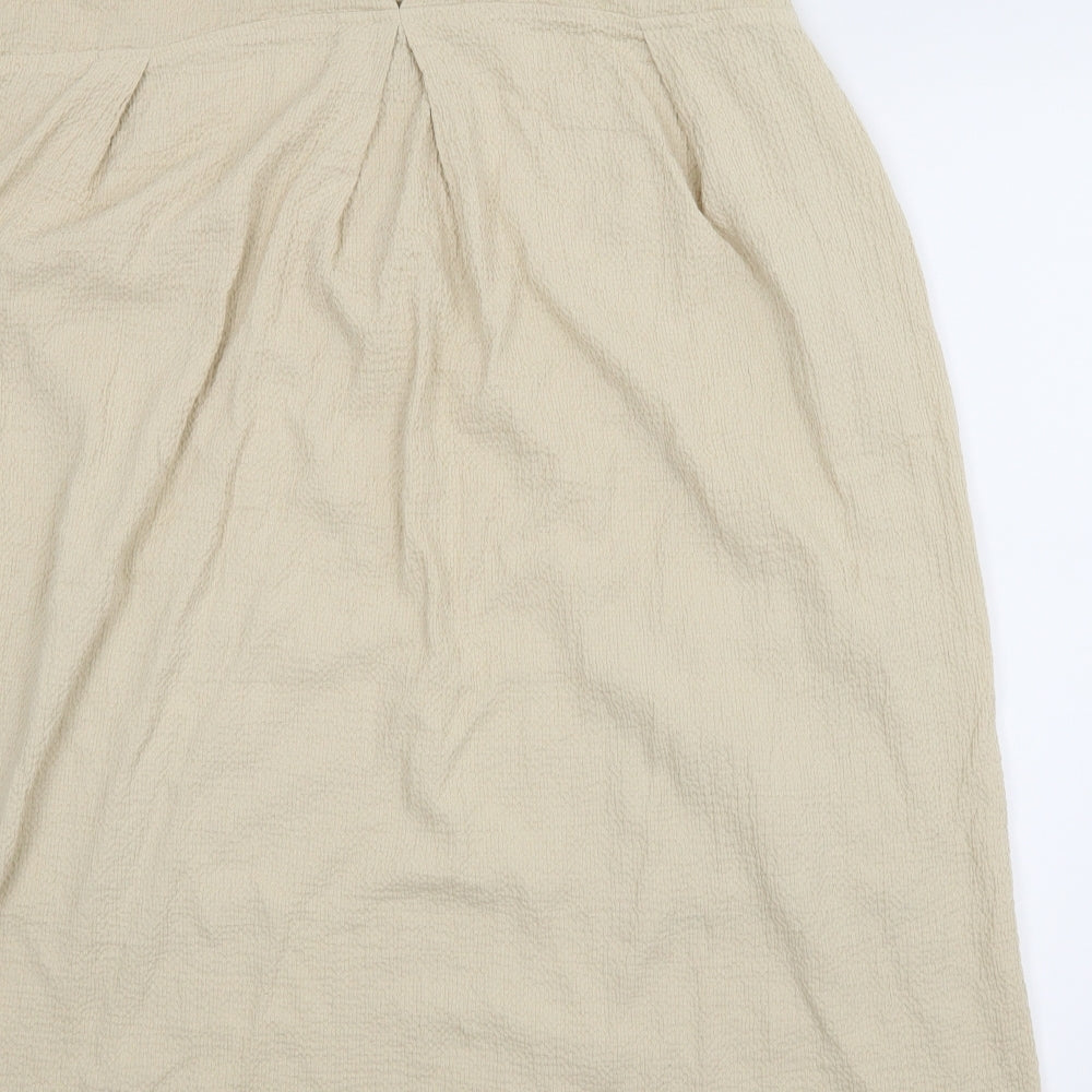 Brand and care label for Vog Style women’s beige tunic blouse, size 2XL
