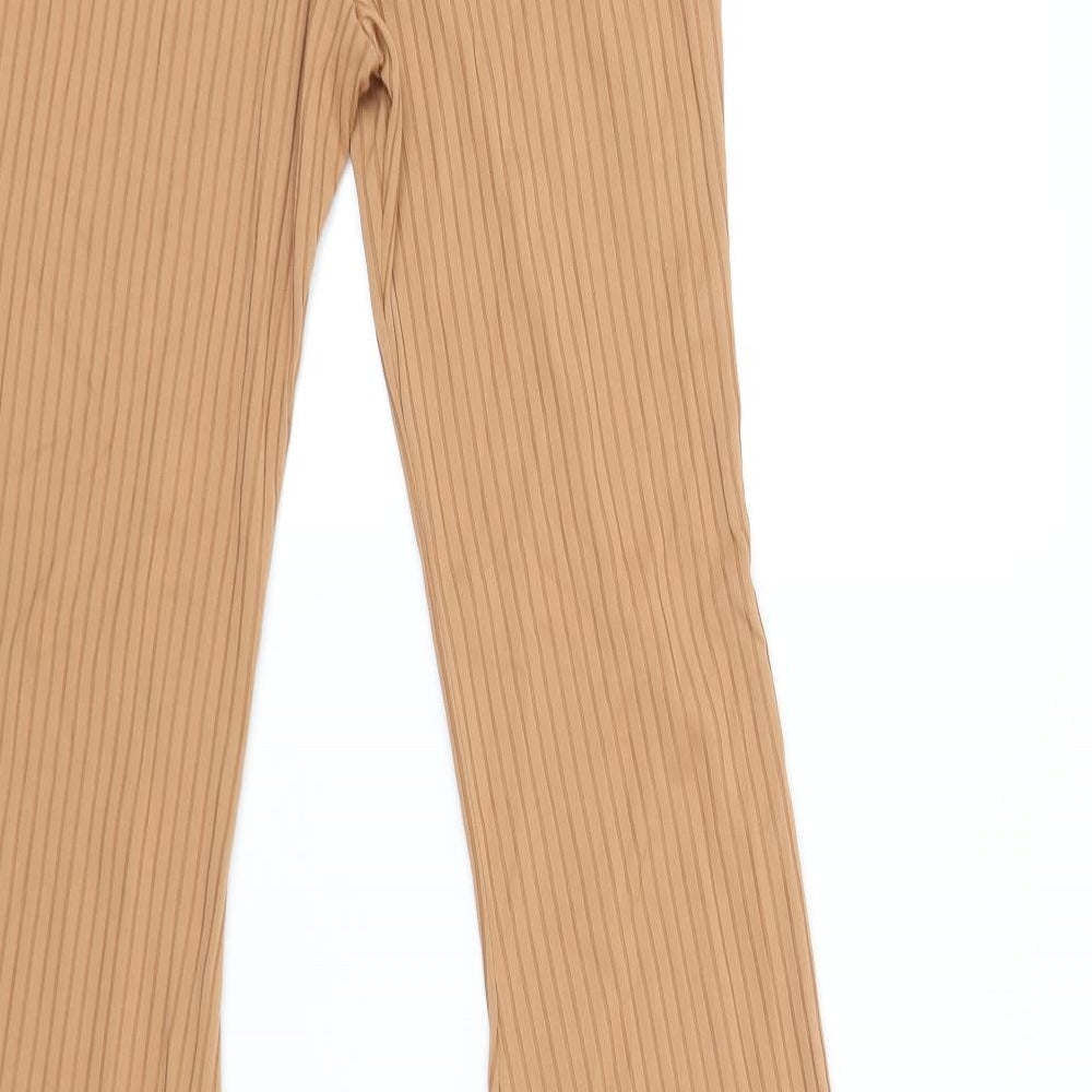 Brand and care label for PRETTYLITTLETHING women’s beige jegging leggings, size UK 12, 35-inch leg