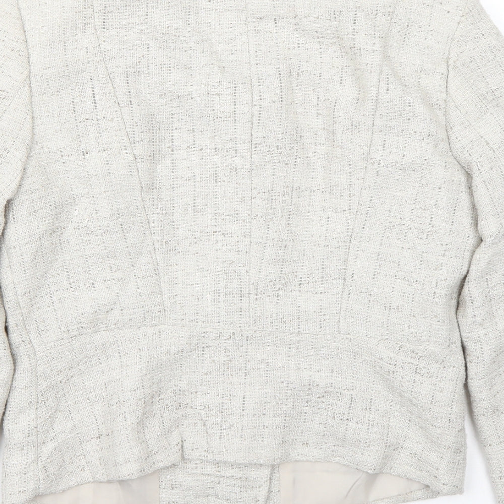 Brand and care label for H&M women’s ivory jacket coat, size UK 6