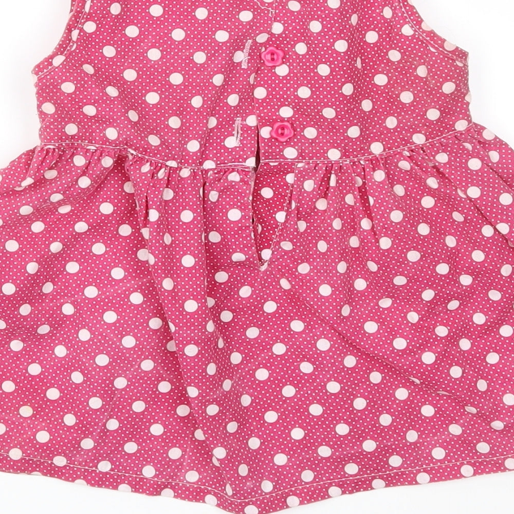 Brand and care label for Isabelle Rose Collection girls’ pink polka dot fit & flare, size 18-24, months