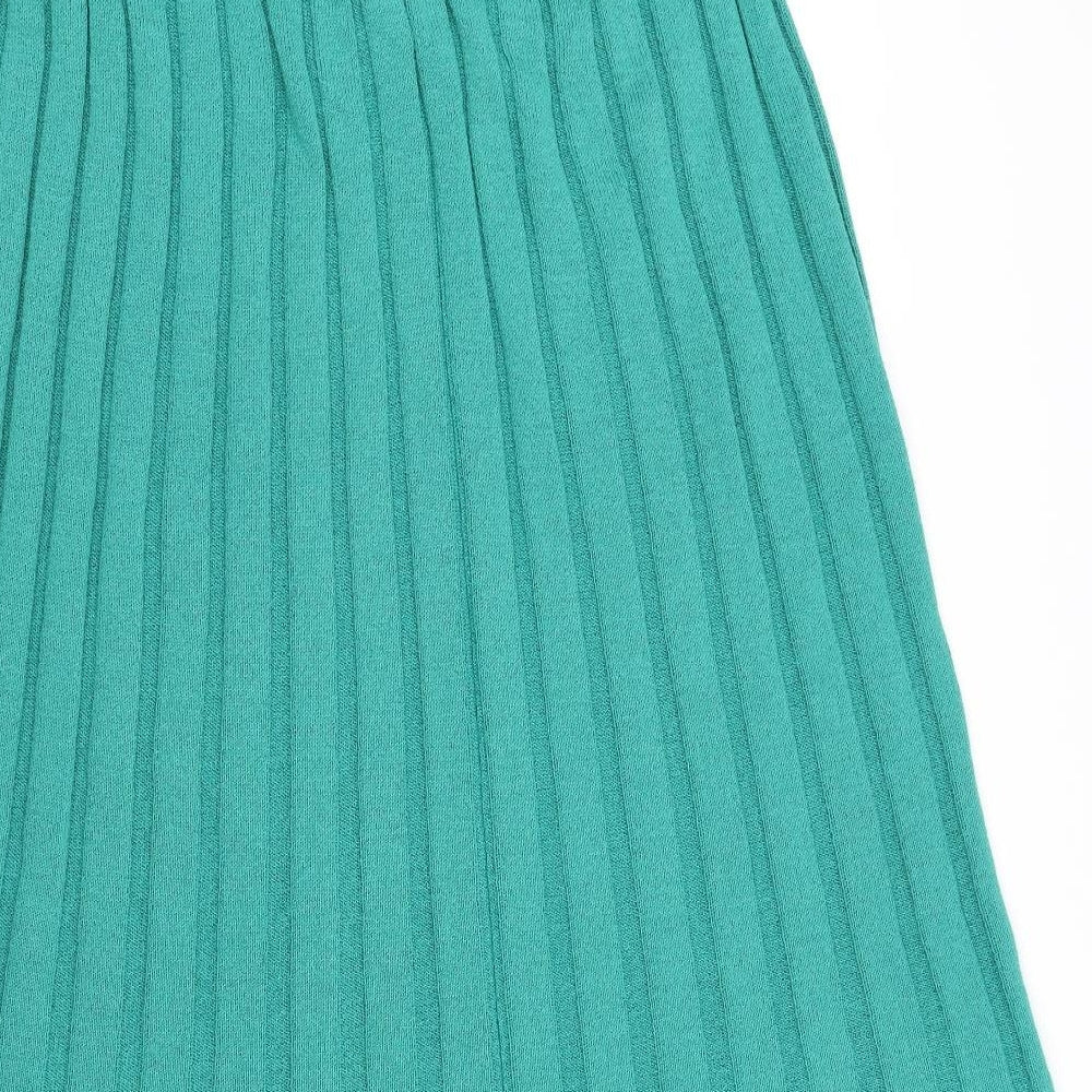 Brand and care label for Equinox women’s green flare skirt, size UK 32, in