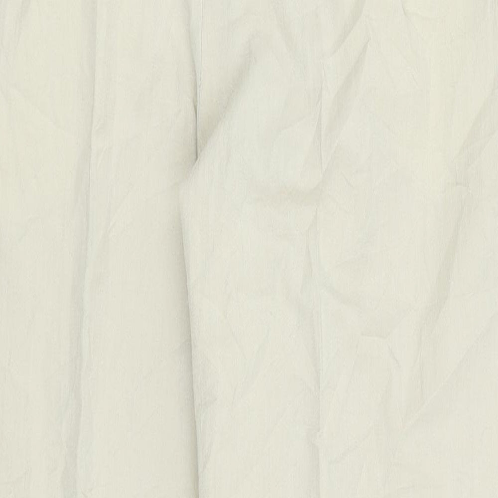 Brand and care label for Ted Nicol women’s beige cargo trousers, size UK 38, in, 28-inch leg