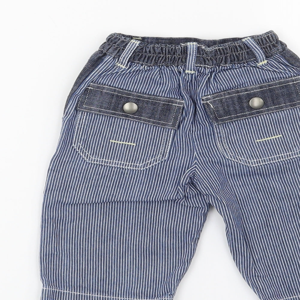 Brand and care label for Mothercare boys’ blue cargo jeans, size 3-6, months