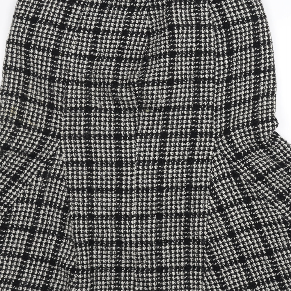 Brand and care label for Per Una women’s black tulip skirt, size UK 12