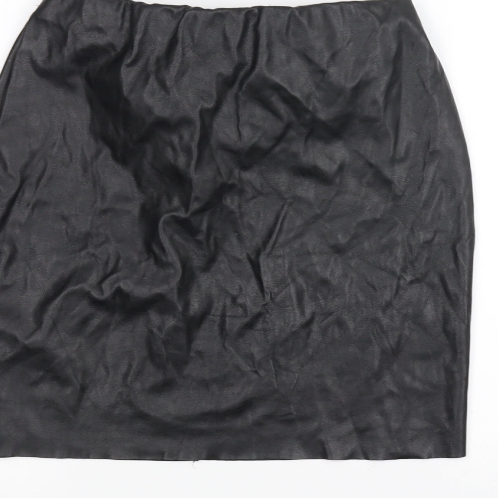 Brand and care label for Boohoo women’s black mini skirt, size UK 8