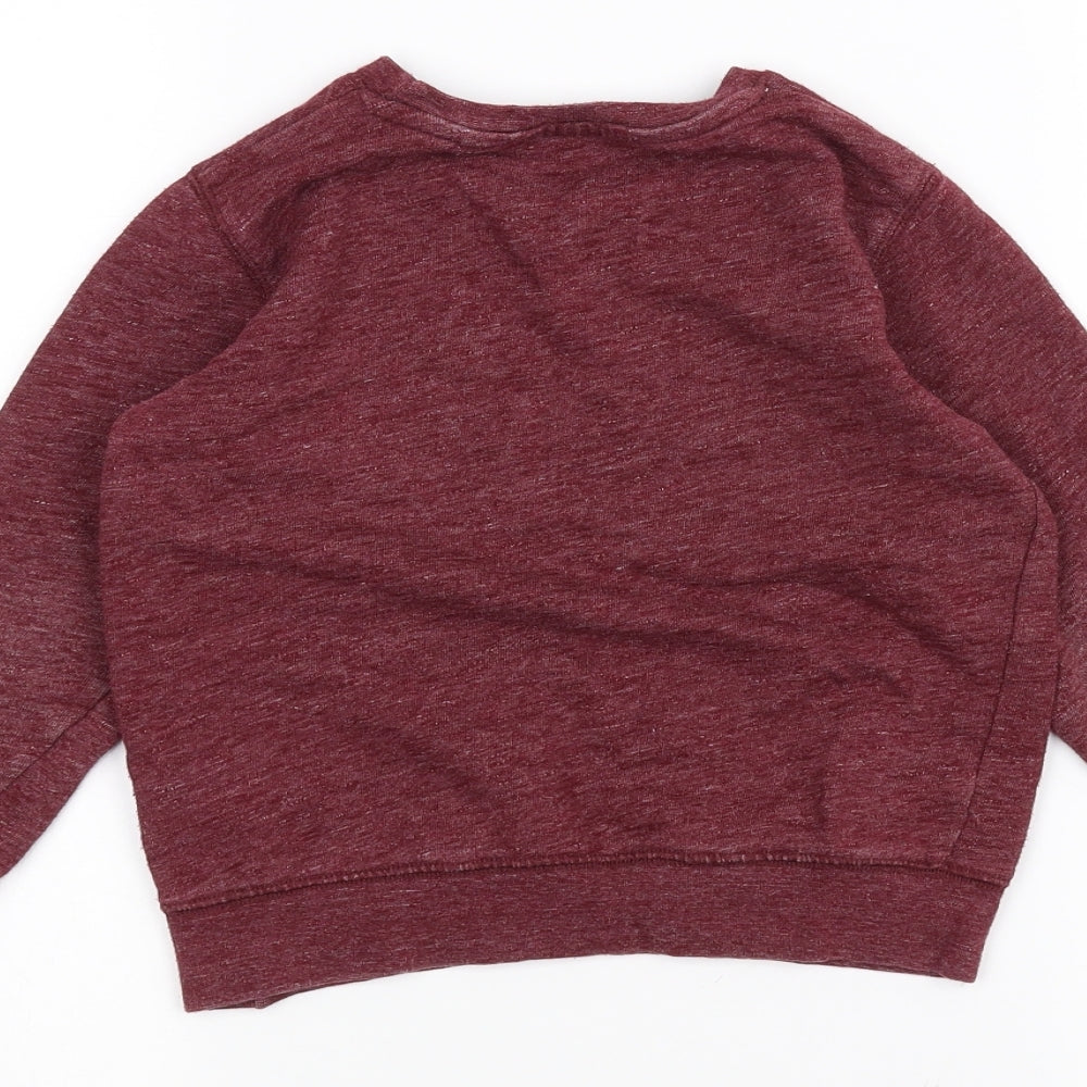 Brand and care label for Next girls’ red jumper, size 4-5, years